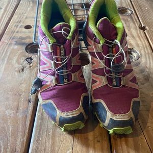 Women’s size 8 Salomon shoes. They have some wear but has lots of tread left.